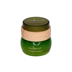 Ekko Beauty Eyebrow Scrub in green glass jar with natural wood lid, designed for nourishing and exfoliating brows with lime and apple extract