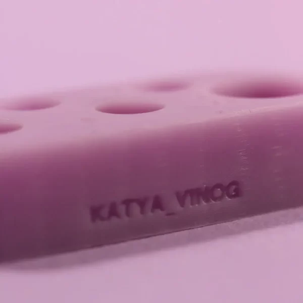 Close-up of a purple Katya Vinog Lash Lift Palette with solution sections labeled for easy identification