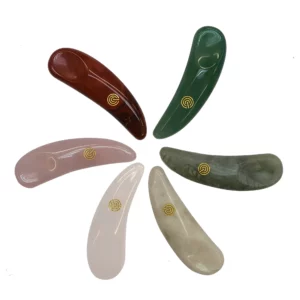 Collection of six Permalift crystal application spoons in various colors, designed for precise application of brow and lash treatments, featuring a gold logo on each spoon