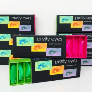 Pretty Eyes lash lift silicone shields in vibrant green and pink packaging, designed to enhance lash lifting results with high-quality silicone in round and flat options