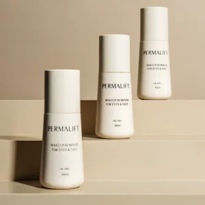 Trio of Permalift Makeup Remover bottles in a minimalist setting, featuring oil-free formula for eyes and face in 100ml size
