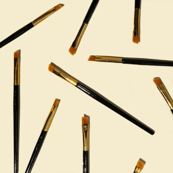 Brow Code Tinting Brushes with gold ferrules, ideal for precise henna and brow tint application