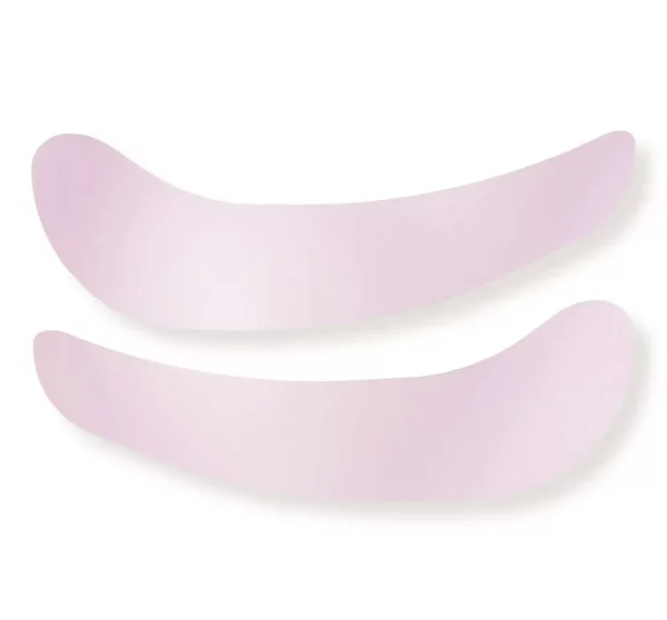 Close-up of Katya Vinog shiny pink silicone under-eye patches for beauty treatments