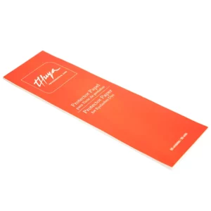 Thuya Protector Paper for eyelash dye in sleek red packaging, designed to shield skin from staining during professional lash tinting