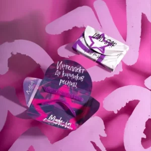 MIA Pro Lashes Lami Star compensators in a purple glitter finish, displayed in open and closed packaging on a vibrant pink background