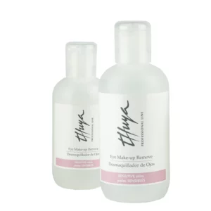 Two transparent bottles of Thuya Eye Make-up Remover for sensitive skin with flip-top caps and soft pink label detailing.