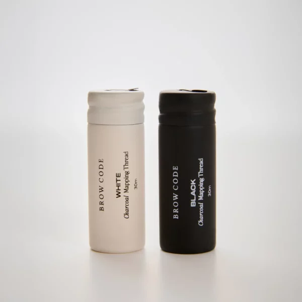 Brow Code Mapping Thread in black and white charcoal versions, 30m rolls, designed for precise brow mapping and professional use