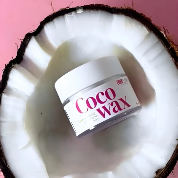 Pink Flash Coco Wax Eyebrow Fixing Wax displayed inside a halved coconut, highlighting its nourishing coconut scent and natural ingredients