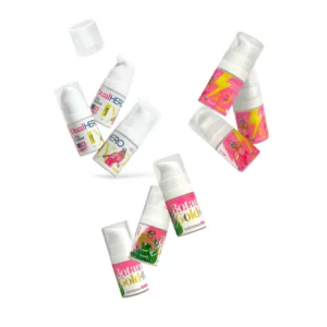 Pink Flash Dual Hero Mini Kit with floating mini bottles of Dual Hero Lift & Treatment, OrganicFix & Tint, and Botanic Gold on a light background.